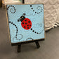 Painted Ladybug Tile on Easel - Blue and Black Dot